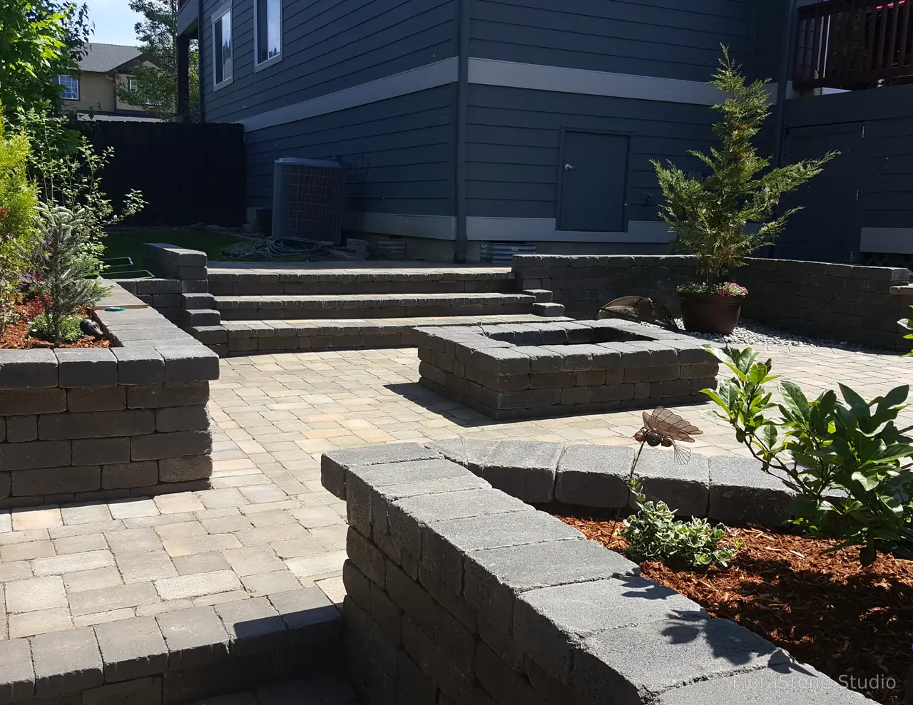 Raised Planters Surround A Paver Patio